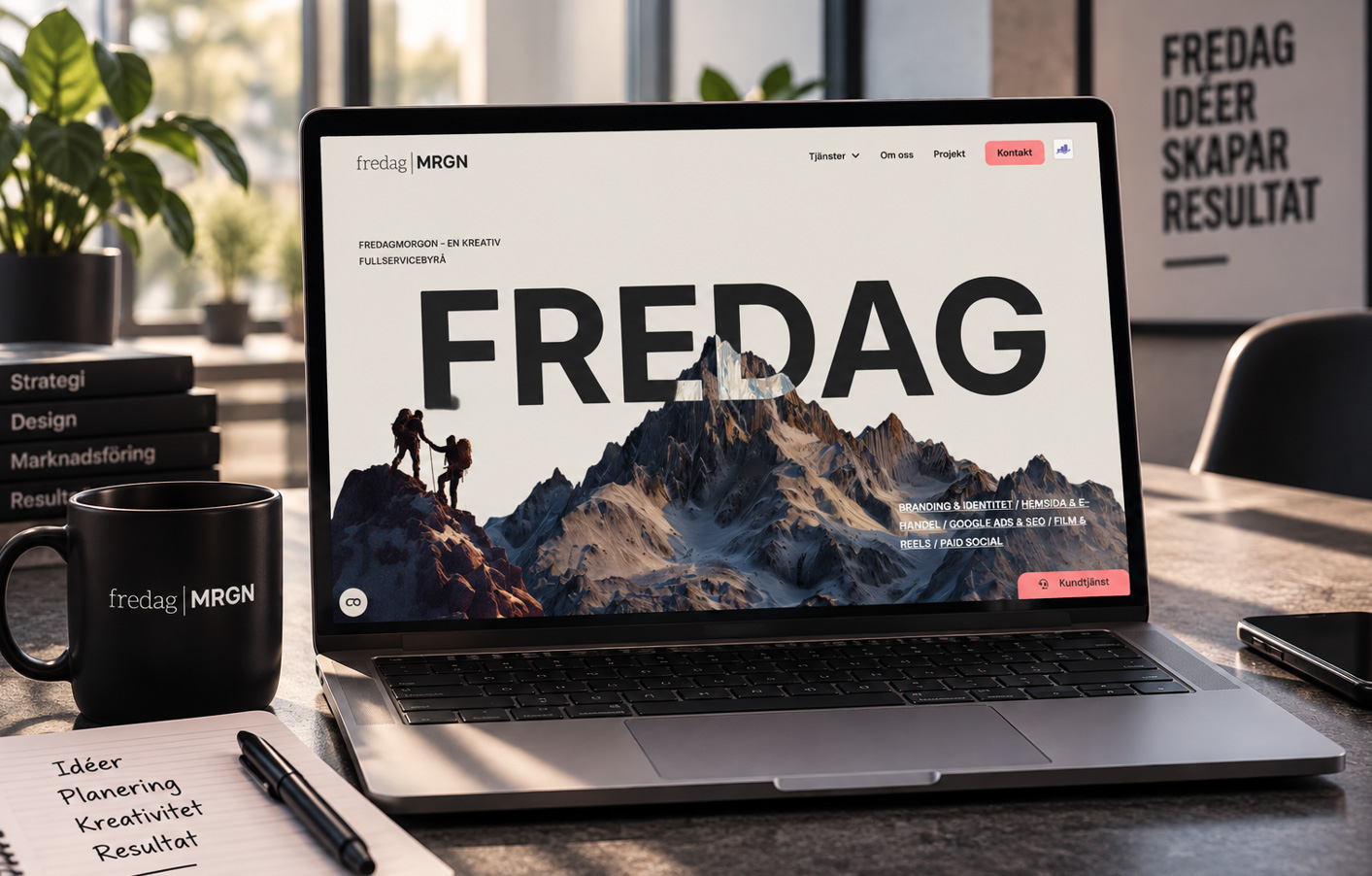 Fredag Morgon's website shown on a laptop in a creative office environment